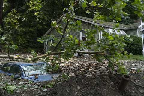 Children lost in flooding as US endures extreme weather, from smoke up north to heat in the West